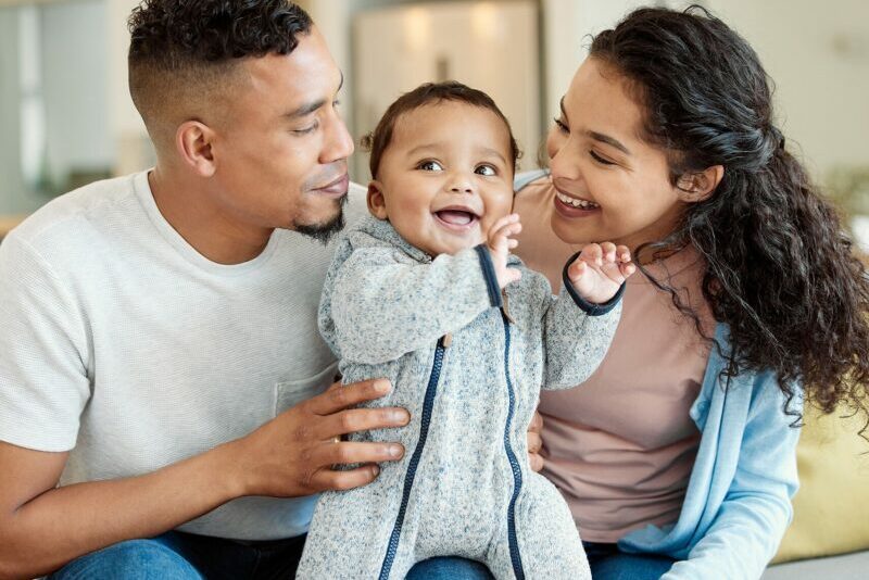 Family sitting together with child