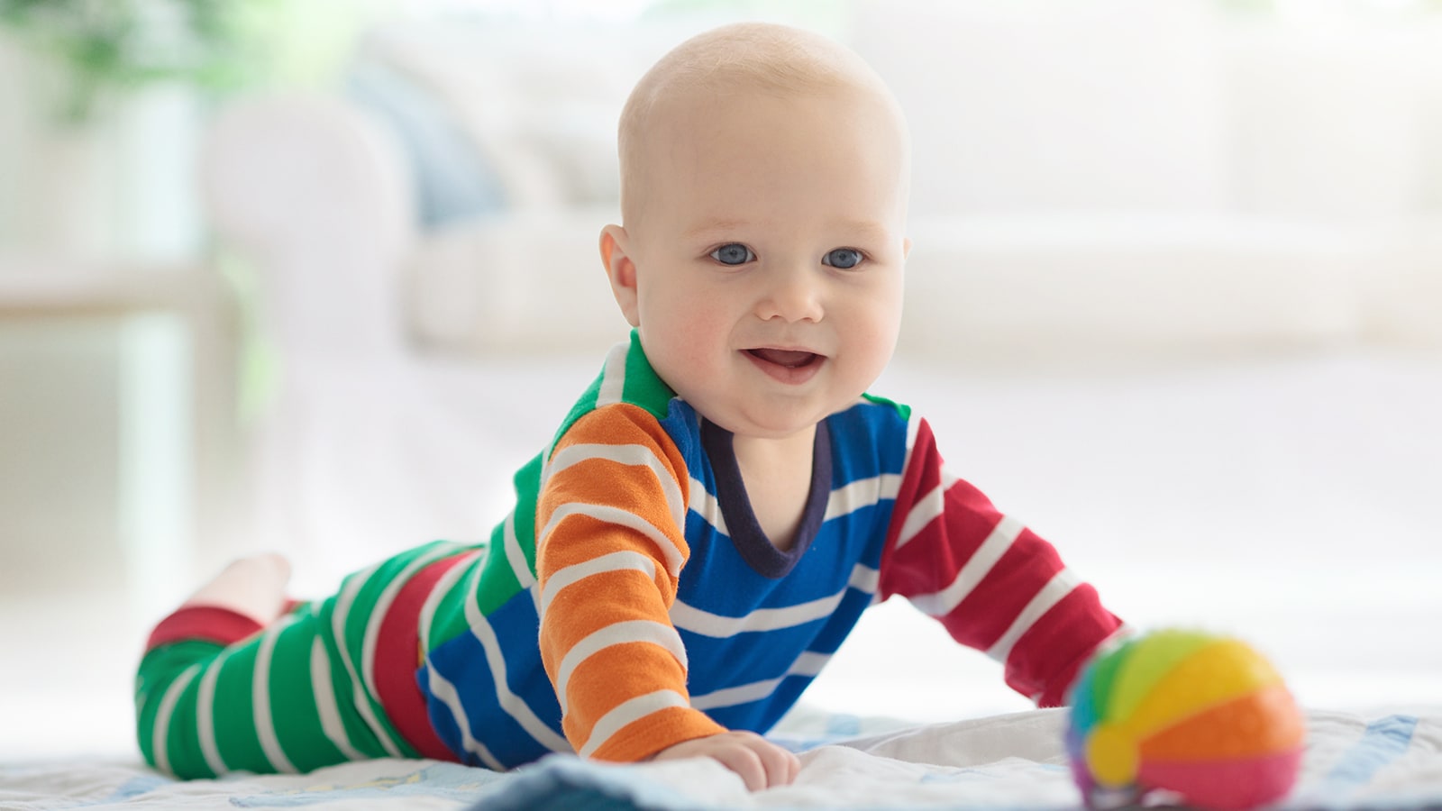A baby pushing up off the ground