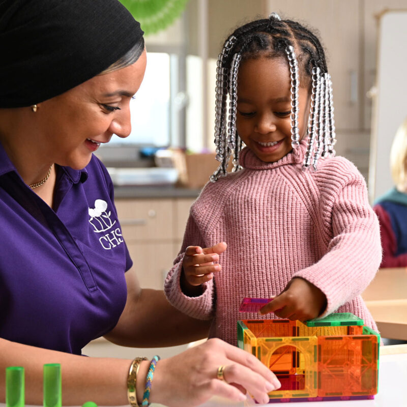 Child and teacher playing