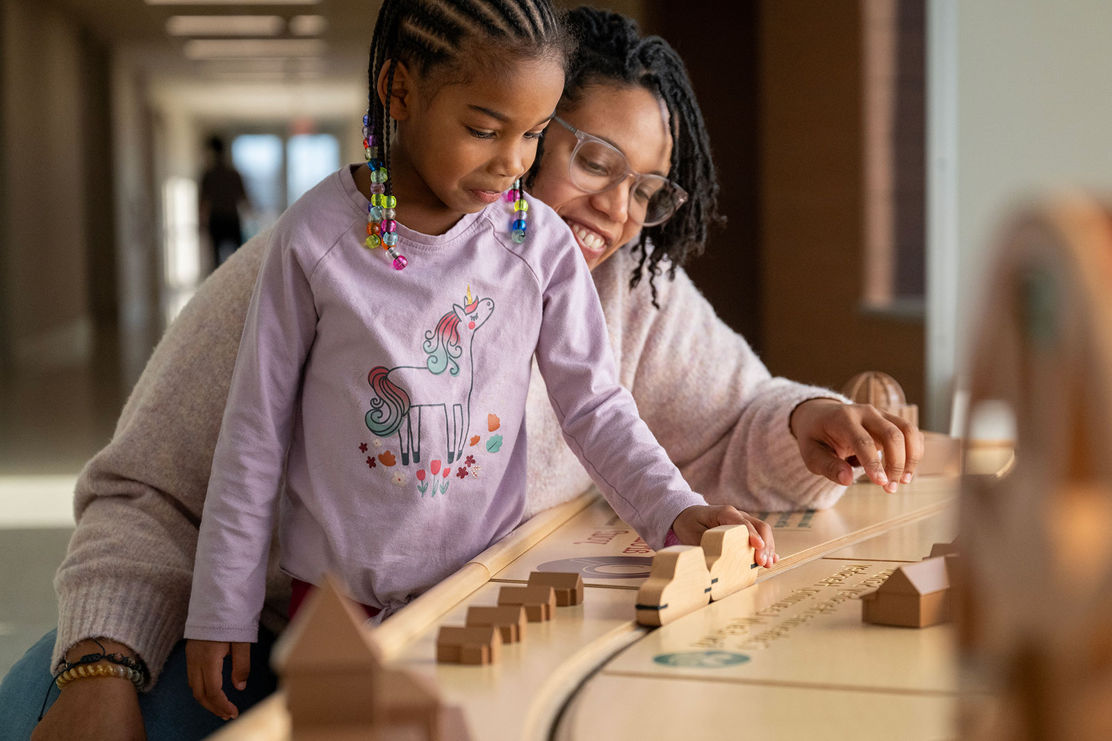 Mother talking to daughter at school